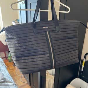 Stella & Dot Crush It carry on in black. Rose gold hardware.